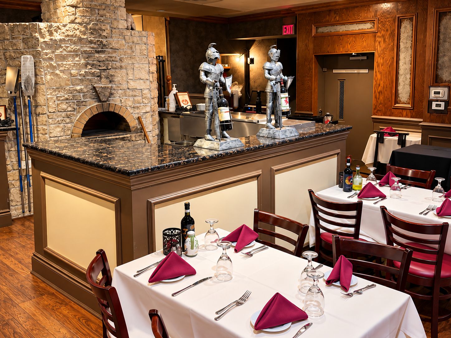 The pizza bar with a stone wood-fired oven and white tablecloths